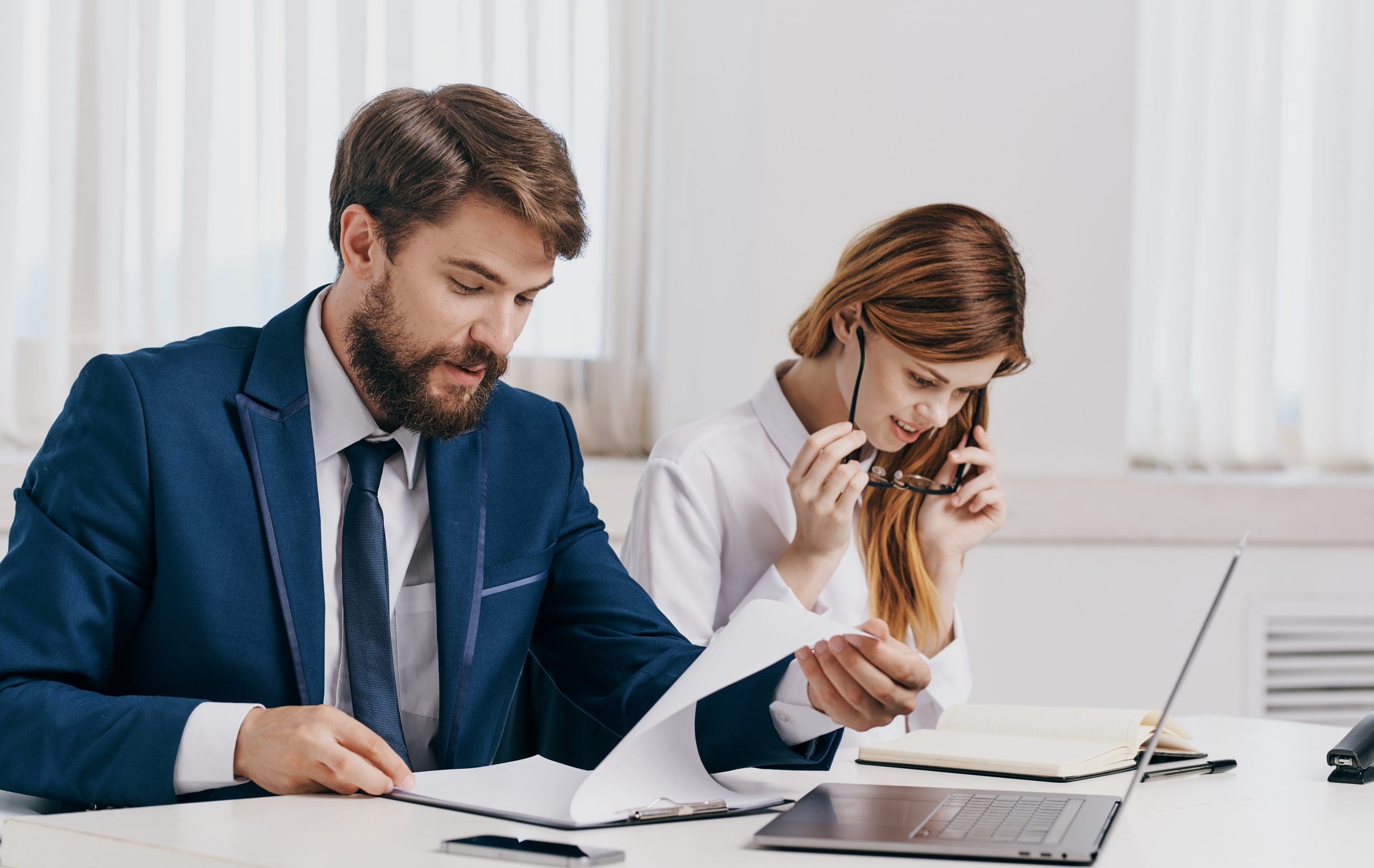 Business people are found with a laptop at the table company employees